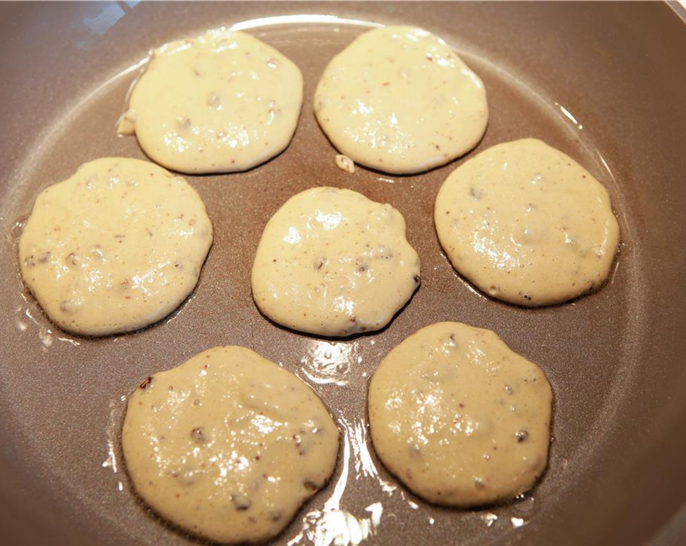 step 5 Blend to a smooth batter. Add Sun-Maid Raisins (1 Tbsp) and mix well. Increase the heat slightly. Spoon 1 tablespoon of mixture at a time in the pan, filling up the pan. Cook for 1 minute, checking by lifting the sides of the pancake for browning.
