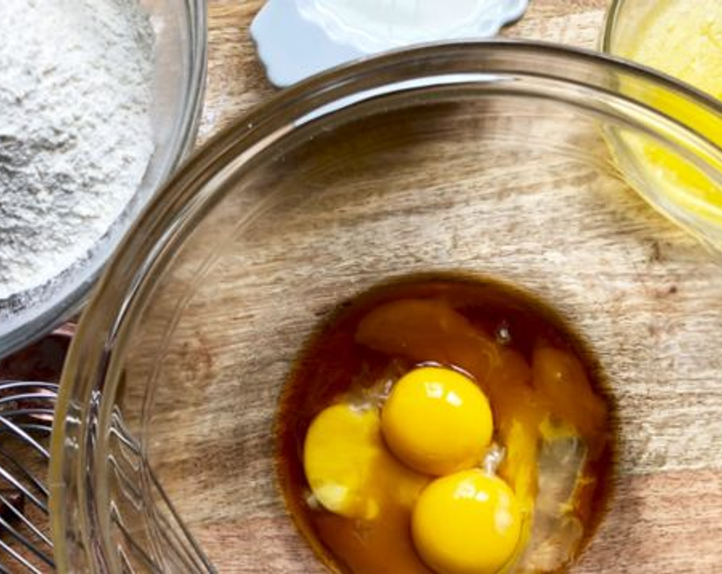 step 2 Put the yolks of the Eggland's Best Classic Eggs (3), Milk (1 cup), Unsalted Butter (4 Tbsp), and Pure Vanilla Extract (2 tsp) into another bowl and beat well.