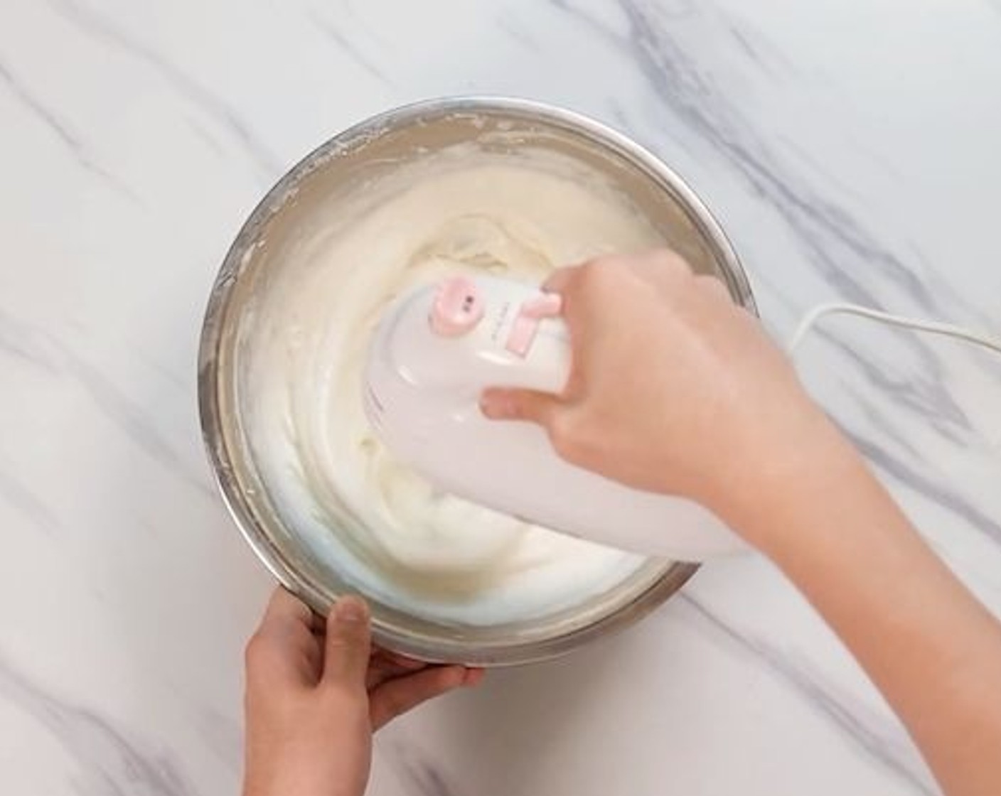 step 5 Once the cream has been well chilled, whip it on high speed until it thickens back, leaving a ripple effect when it’s being mixed.