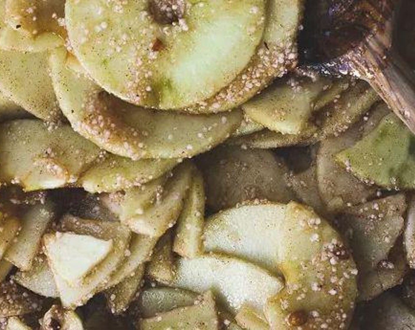 step 4 Add the Granulated Sugar (1 cup), Butter (2 Tbsp), Simply Organic Cinnamon, Ground (2 tsp), Ground Nutmeg (1/2 tsp), Ground Allspice (1/2 tsp), Vanilla Extract (1 tsp), Ground Cardamom (1/4 tsp), Instant Tapioca (2 tsp), Apple Cider Vinegar (1 Tbsp) and Fresh Ginger (1/2 tsp) to the apples. Mix until uniform.